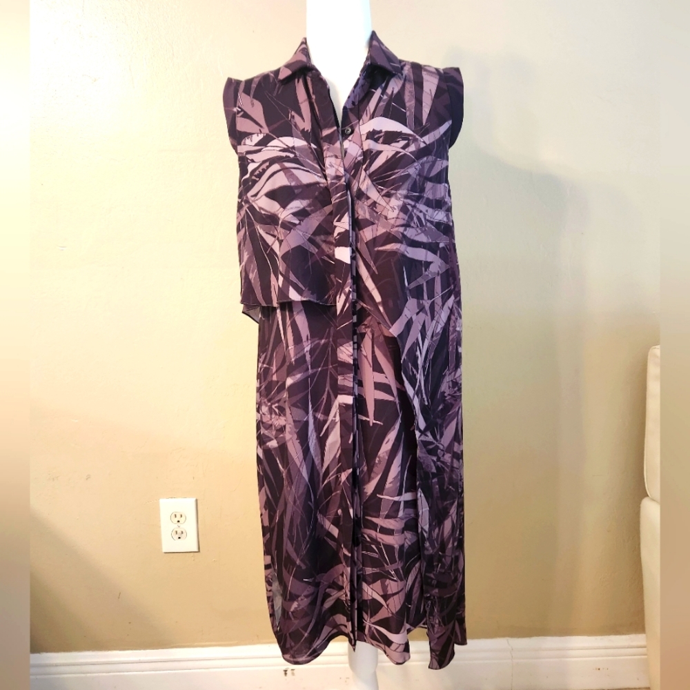 Full button up dress with collar. Has a layered look.